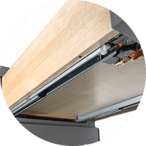 Close-up of a concealed undermount soft-close drawer glide