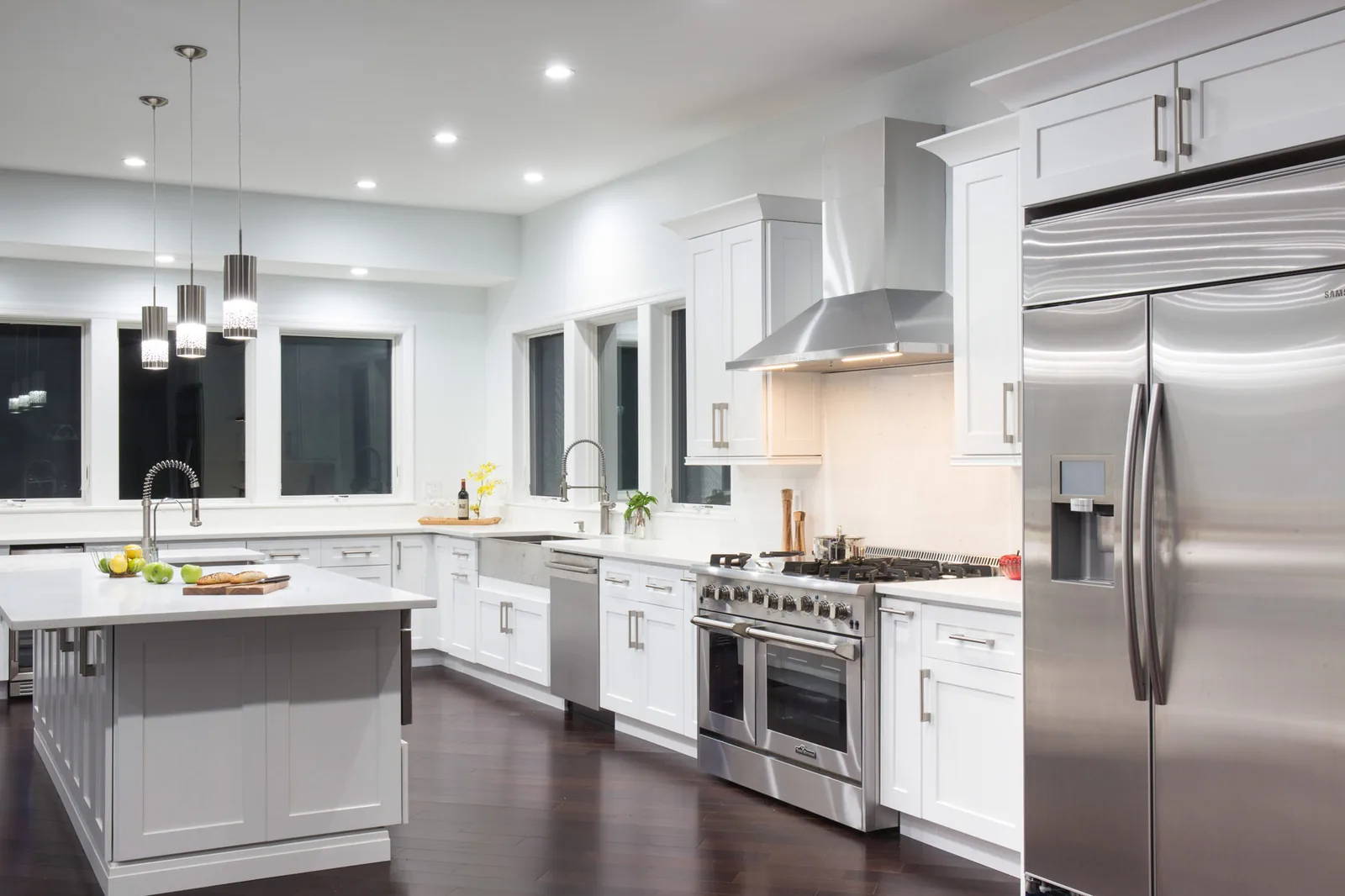 A white shaker kitchen with a large island
